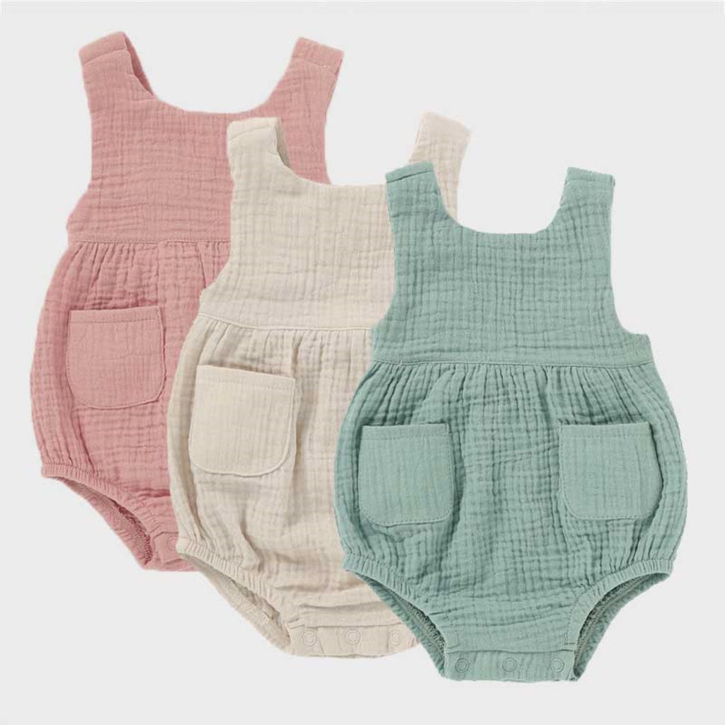 Baby girl muslin romper in pink, cream, or sage green.  Made from GOTS certified organic cotton.